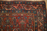 Geometric Samovar main border of an antique Persian Bijar rug in dusty rose and sapphire blue.