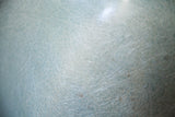 Seafoam green Herman Miller chair surface, showing distinct playful fibrous texture.