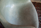 Vintage seafoam green Herman Miller chair seat with playful fiberglass texture.