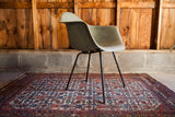 Side view of vintage collectible seafoam green Herman Miller chair shell.