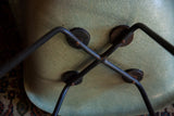 Black X base and large shock mounts on the fibrous seafoam green Herman Miller chair.