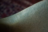 Vintage Herman Miller chair seafoam green fiberglass shell with playful fibers.