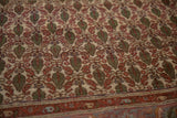 Vintage Sarouk rug pattern: green cypress botehs, terracotta flowers, and serrated border.