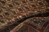 Rolled vintage Persian Sarouk rug, ivory ground with cypress tree motifs and serrated floral border.