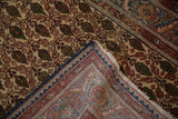 Corner of vintage Sarouk rug revealing fine fringe, navy blue selvage, and its reverse foundation pattern.