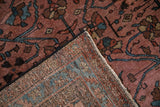 The hand-knotted back and intact side cord selvage of an antique Persian Lilihan rug.