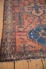 Antique Borchalou rug runner's madder red field, cobalt geometric mahi-mahi, Serbend border with wear.