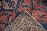 Antique Borchalou rug's hand-knotted foundation and red, blue pile with wear to knot heads.
