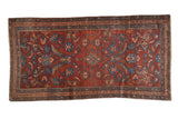 Antique Mehriban rug with large-scale floral palmettes in sky blue and rose on an abrashed, wine-red field.