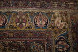 Antique Kermanshah rug corner with green gold border, expressive turtle samovar motifs, and time-softened pile.