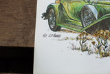 J.B. Rivard signature, green Duesenberg car wheel, and flowers on vintage lithograph.