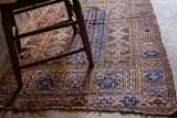 Intricate geometric patterns on a Belouch prayer rug with excellent purple and deep blue tones.