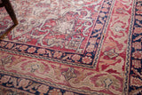 Worn Safavid-inspired border of antique Kerman rug, in cochineal red and dark blue.