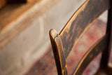 Antique chair top backrest, displaying a visible crack and dark aged wood patina.