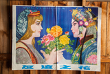 Vintage Chinese advertising poster: two women exchanging colorful flowers on blue.