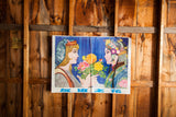 Vintage Chinese advertising poster with vibrant women and flowers, showing fold marks and wrinkles.