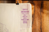 Purple block text title on the vintage Town of Greenburgh map listing local villages.