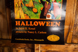 Orange title text, author, and publisher details on the vintage Halloween poster.