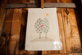 Multi-color etching print displaying geometric trees, red bird, and sun.