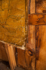 Lower corner of the aged golden-yellow 1868 North America map, showing creases and peeling.