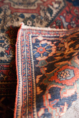 Fine weave and detailed floral border of an antique Farahan Sarouk collector rug.