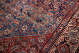 Intricate Herati pattern on fine dark indigo field, varied colors, detailed red border.