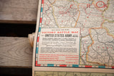 Close-up of the vintage battle map's title block with red and blue typography and legend.