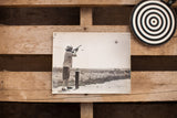 Vintage Carole Lombard photograph detail: rifle firing with circular target.