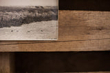 Vintage shooting range photograph bottom edge, showing sandy ground, bullet casings, handwritten details.