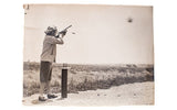 Vintage 1938 black and white photograph of actress Carole Lombard at a shooting range.