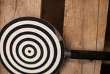 Slight peeling on the black and white concentric disk of German eye equipment.