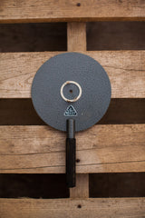 Black ribbed handle and Oculus label on vintage German eye equipment, showing minor peeling.