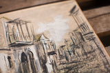 Angled close-up of the gouache painting's textured brushwork and muted street scene.