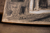 Artist Zvi Raphaeli's black signature on the gouache painting of a muted street scene.