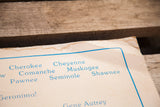 Browning and moisture stains along the creased corner of the vintage cardboard poster.
