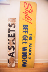 Mid Century Modern Bee Gee Window advertising sign and a weathered 'BASKETS' sign.