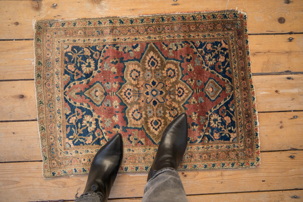 Overhead view demonstrating the diminutive scale of the antique Farahan Sarouk rug.