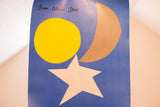 Vonnegut book poster showing 'Sun Moon Star' text, yellow sun, tan crescent, white star.