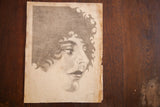 Flapper portrait profile with curly hair, artist signature, 1926 date, and torn paper edge.