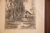 Vintage 1944 etching of a rustic cottage in a serene woodscape with a pond, signed in pencil.
