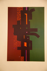 Geometric abstract forms in dark green, black, and orange from the Edgard Pillet print.