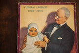 Close-up of the vintage Putnam Dyes fan lithograph showing the founder holding a baby.