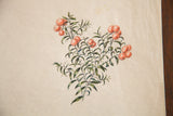 Antique watercolor detail of deep green foliage, rose-red berries, slight creases, and a tear.