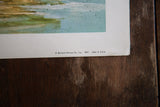Copyright and publisher information printed on the vintage beach lithograph.