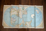 Full view of a 1940s National Geographic world map with its unique Northern and Southern Hemisphere layout.