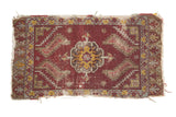 Antique Turkish mat, ruby red medallion, geometric yellow and grey patterns, worn.