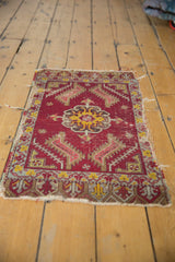 Worn antique Turkish mat, ruby red central medallion, and geometric motifs. 1'7