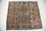 Antique Kerman rug's expressive leaf-and-vine design in aged purple, blue, and ivory tones.