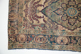 Antique Kerman rug corner: deep purple, blue leaf/tree design on ivory, wear to foundation.
