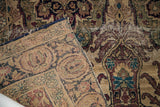 Hand-knotted antique Kerman rug, showing expressive pile design and woven ivory foundation.